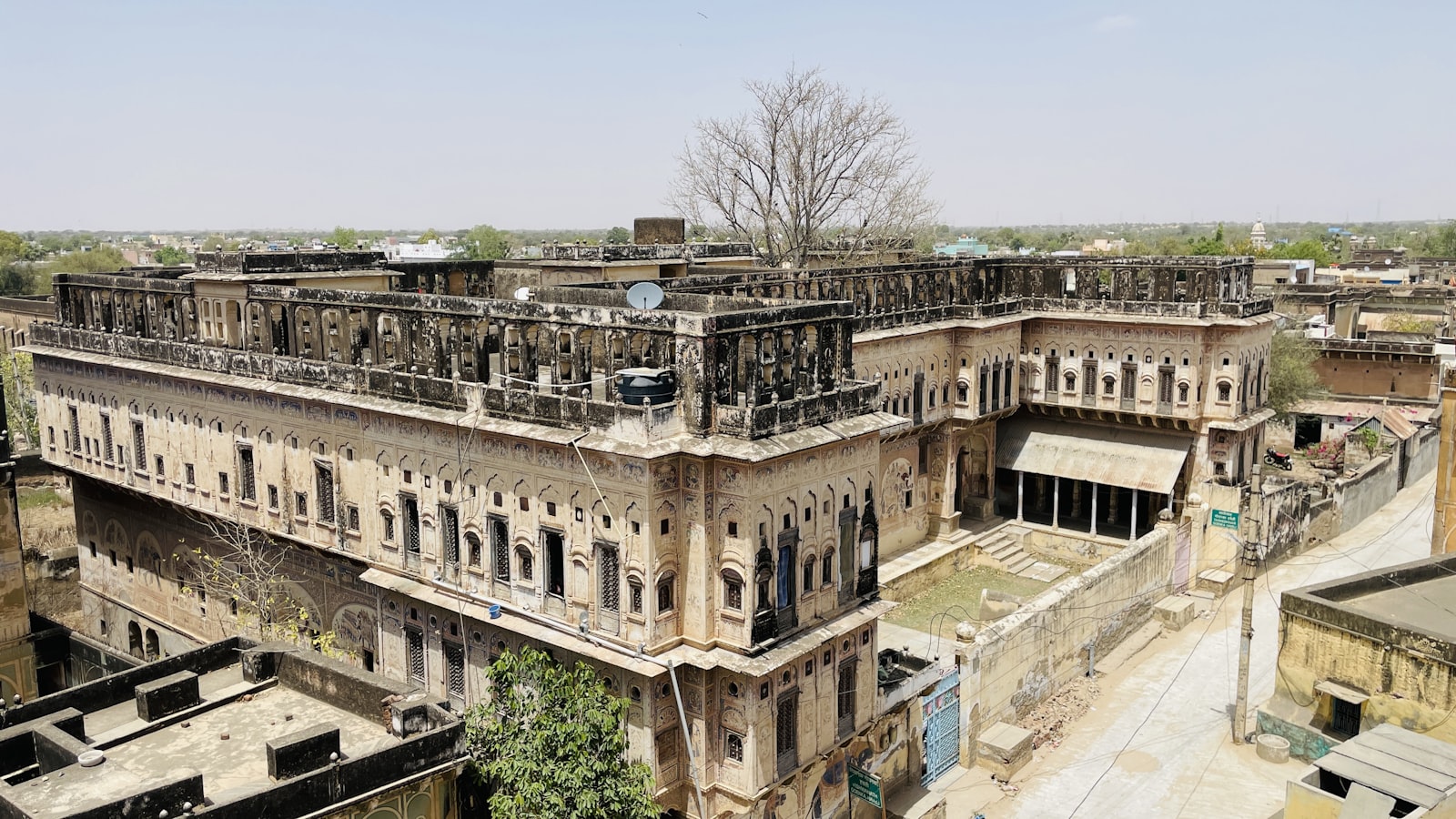 Traditional Rajasthani haveli facade with layered courtyard windows and balconies